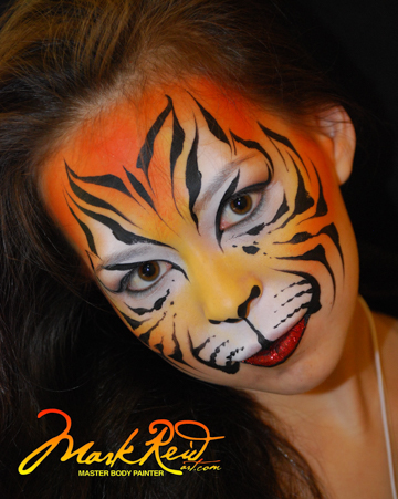 young woman in a tiger face painting